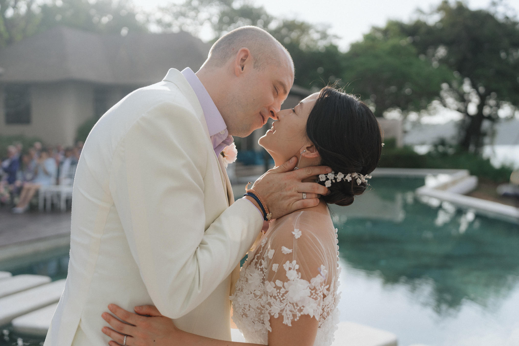 Groom kissing the bride on the wedding